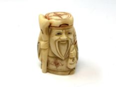 A carved Chinese bone netsuke,