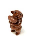 A carved Chinese wooden netsuke,
