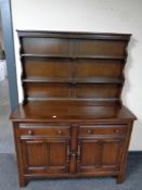 An Ercol elm and beech welsh dresser in an antique finish