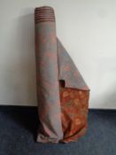 Two rolls of material and a piece of leather