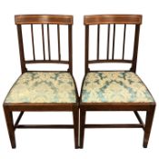 A pair of George III inlaid mahogany dining chairs, rail backed and on square tapered legs,