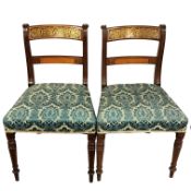 A pair of Regency mahogany dining chairs,