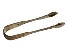 A pair of Georgian silver sugar tongs, maker HS. CONDITION REPORT: 56.