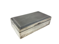 A George VI silver cigarette box, with inscription 'Presented to Mr.