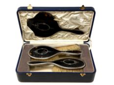A George V four-piece silver-mounted tortoiseshell dressing table set, Birmingham 1926,