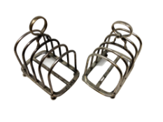 A pair of Edwardian silver five-bar toast racks, James Parks, London 1904, each 9cm long.