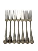 A set of seven George III silver dessert forks, indistinct London marks.