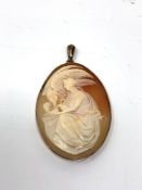 An antique 9ct rose gold cameo pendant depicting Leda and the Swan