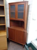 A mid 20th century Danish teak corner cabinet