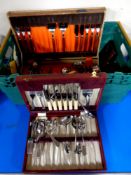 A crate containing a canteen of stainless steel teak handled cutlery together with further canteen