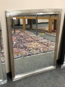 A contemporary silvered mirror,