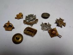 A bag containing a quantity of World War II era military badges