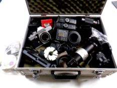 An aluminium case of Praktica MTL3 camera, camera lens, flashes,