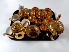 A tray containing a 15 piece Wade gilt coffee service together with a further Bavarian gilt tea