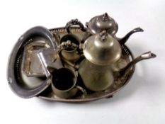 A four piece 20th century plated tea service on twin handled serving tray on raised feet together