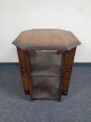 An octagonal oak Arts & Crafts book table