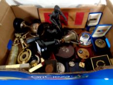 A box containing a collection of trophies and medals relating to shooting