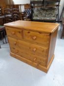 A pine four drawer chest