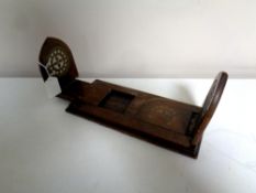 An Edwardian adjustable book slide