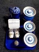 A tray containing three T G Green Cornishware lidded pots,
