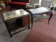 A 20th century carved oak tile topped side cabinet together with a further carved beech tile topped