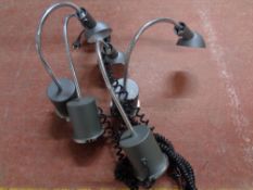 A set of four metal angle poise table lamps on weighted bases (continental wiring)