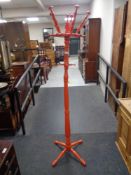 A painted mid 20th century hat and coat stand