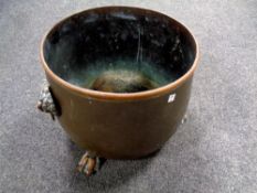 A 19th century copper lion mask planter on paw feet