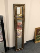 A narrow contemporary mirror,
