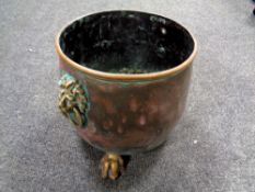 A 19th century copper lion mask planter on paw feet