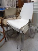 A set of five stacking chairs on metal legs (white)