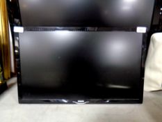 A Phillips 24'' LCD TV with remote,