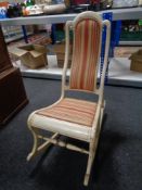 An early 20th century painted rocking chair