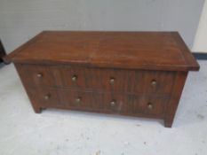 A contemporary storage coffee table with faux drawers