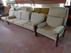 A Scandinavian 1970s rosewood framed three piece lounge suite upholstered in a beige fabric