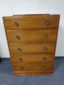 A mid 20th century five drawer chest