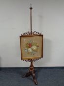 A Victorian mahogany tapestry pole screen