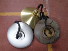 Three 1970s circular metal pendant light fittings