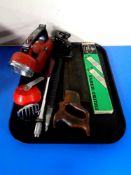 A tray containing a Faber Castell slide rule, boxed, vintage hand saw, hole punch,