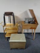 A 20th century SInger electric sewing machine in table together with a set of four teak topped