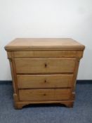 A late 19th century continental mahogany empire style three drawer chest