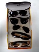 A box containing five pairs of Rayban prescription sunglasses,