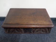 A late 18th/early 19th century carved oak clerk's writing box