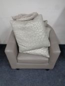 A taupe leather tub chair together with four cushions
