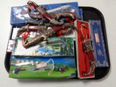 A tray containing a quantity of boxed and unboxed replica oriental and Persian style knives