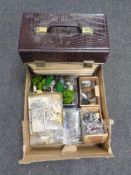 A box containing miniature lead soldiers, painted and unpainted,