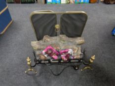 A brass framed three-way folding spark guard and a log effect electric fire