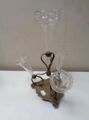 An early 20th century silver plated epergne with four glass flutes
