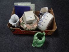A box containing assorted ceramics to include Royal Doulton Christmas plate, Sylvac vase,