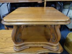 A contemporary oak two tier square coffee table
